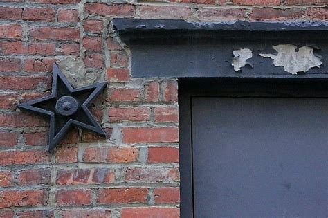 are metal stars on houses mean|cast iron stars on buildings.